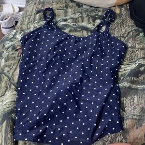 Navy blue polka dotted tankini swimsuit top